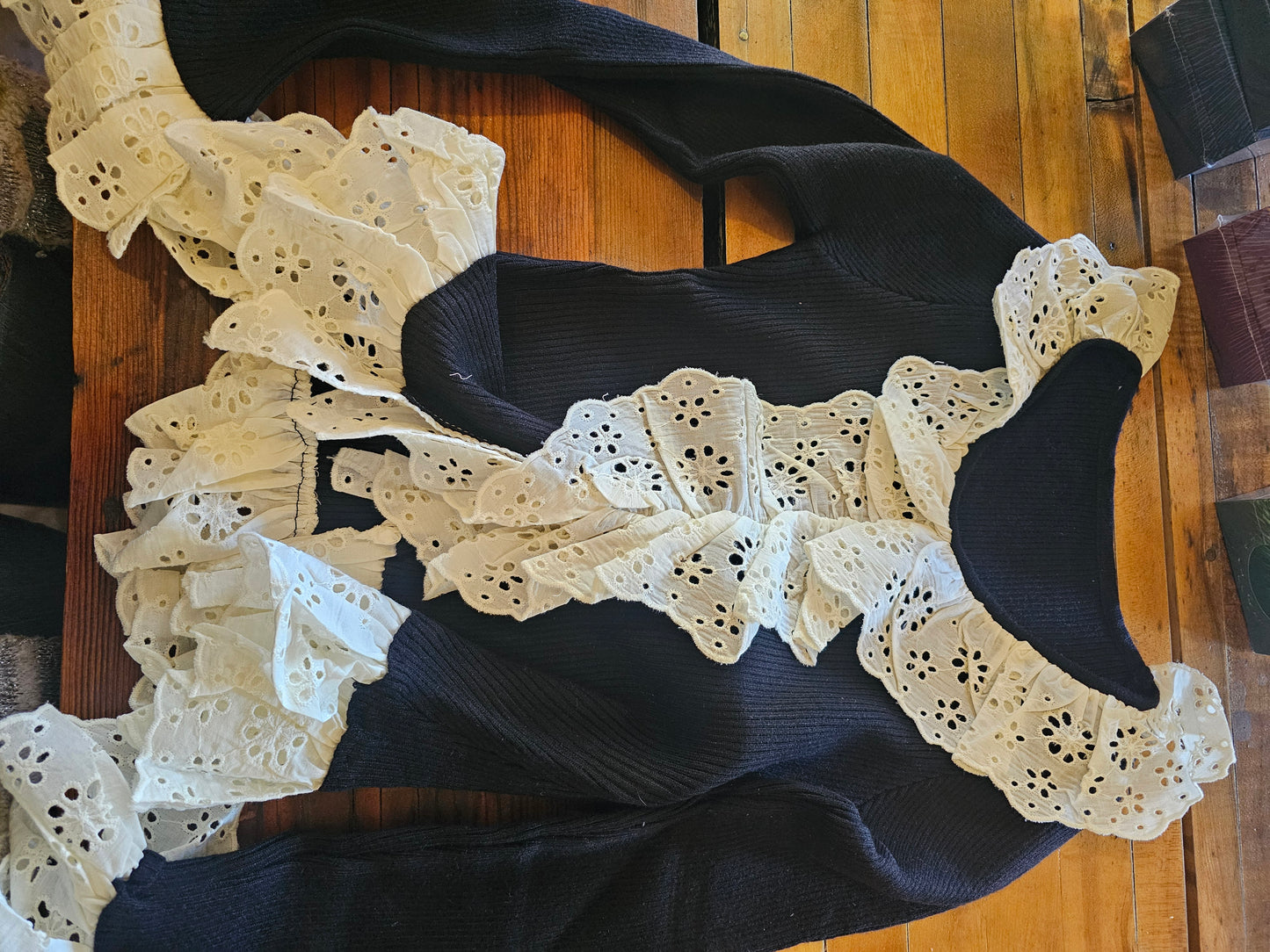 Black ruffle cuff sweater